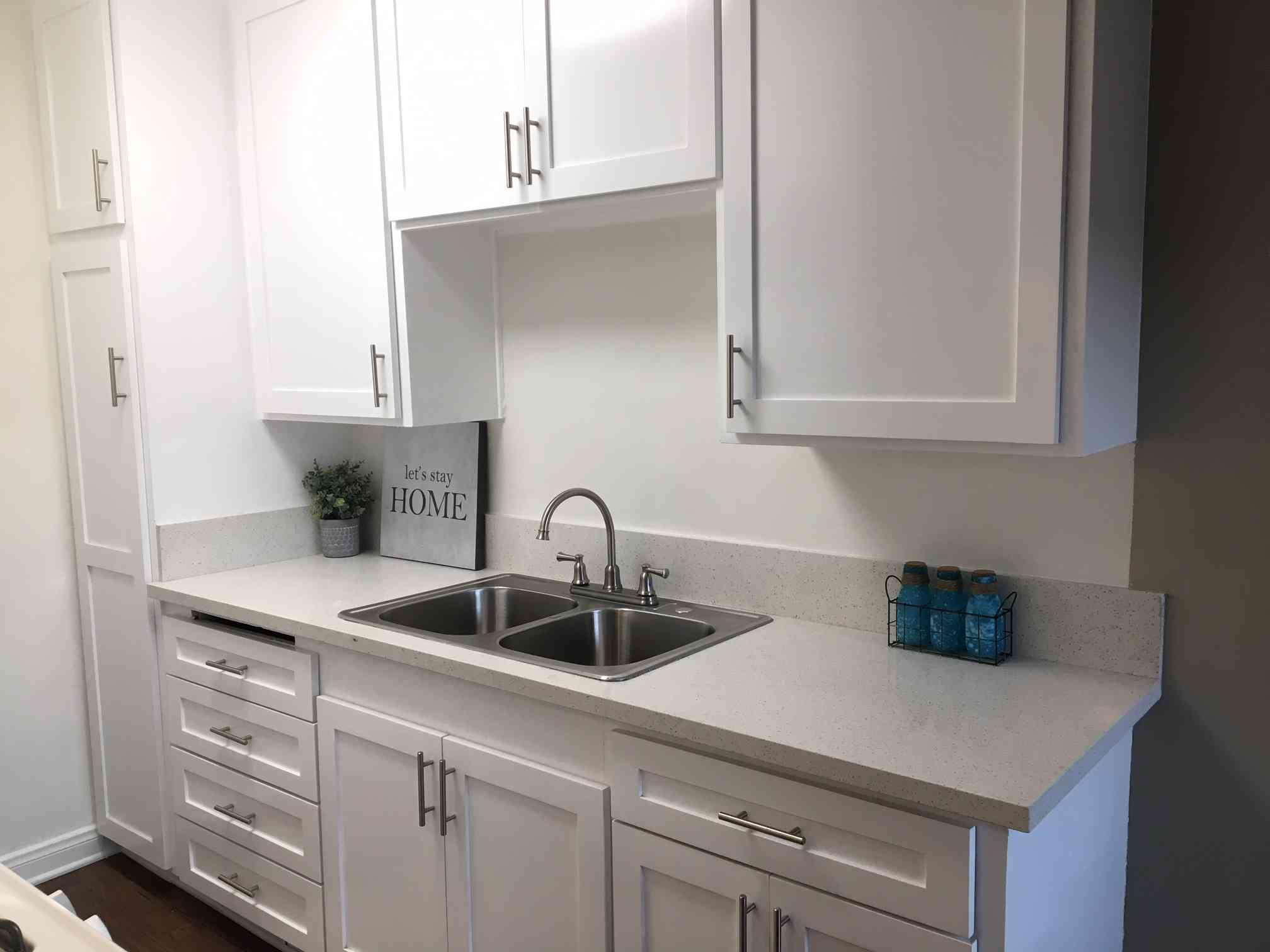 bright kitchen with double basin stainless steel sink