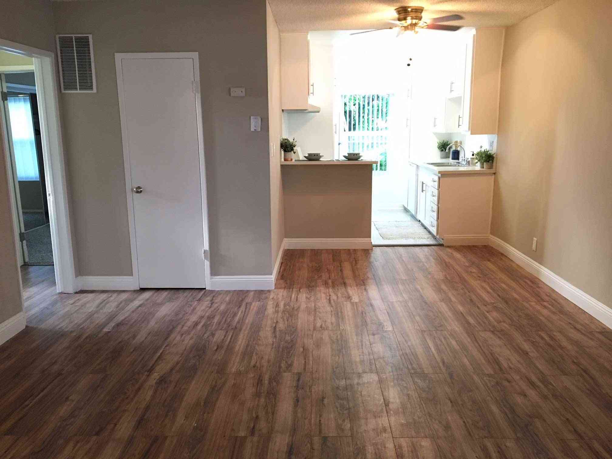 spacious living room opening to kitchen