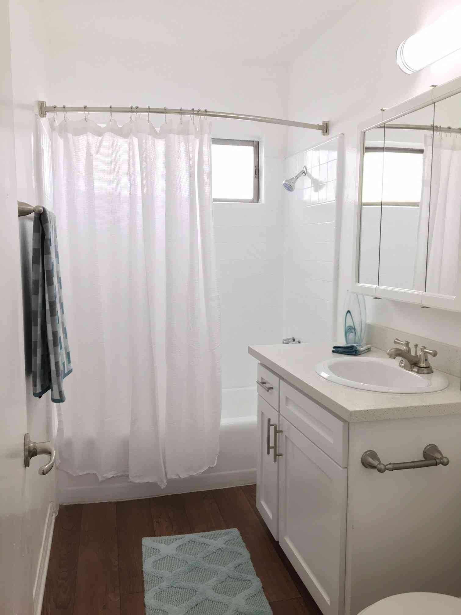 renovated bathroom with white vanity